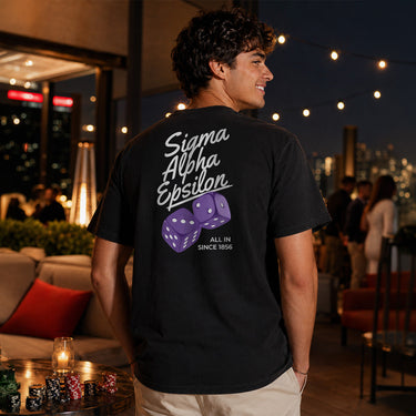 Model wearing the High Roller Tee from the back, featuring a full back dice graphic on a black Comfort Colors tee.